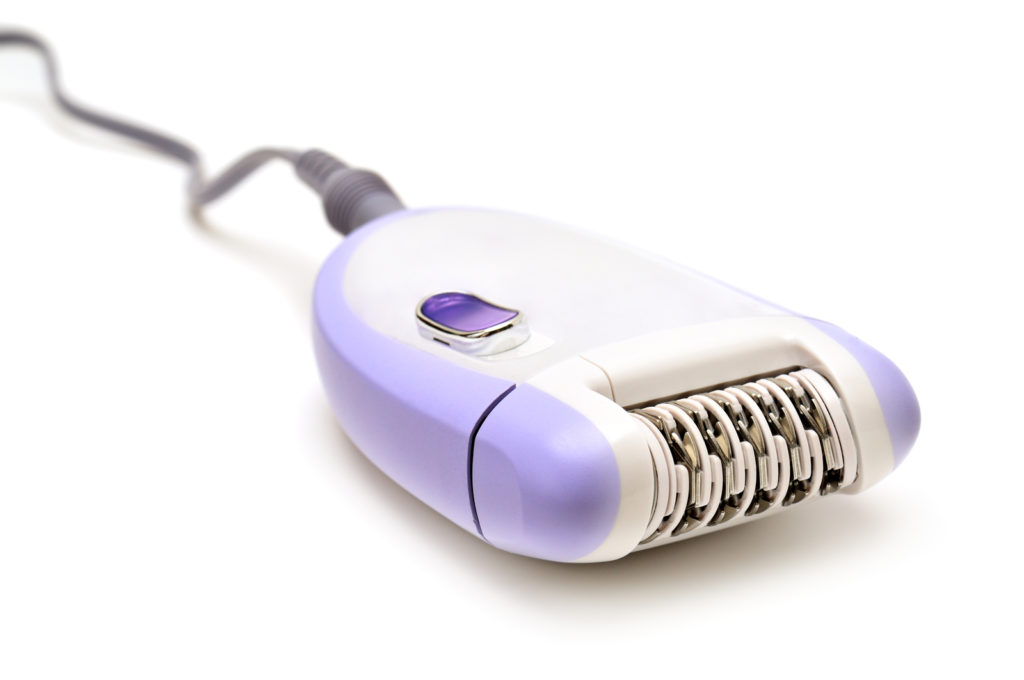 How to choose an epilator. Epilator isolated on a white